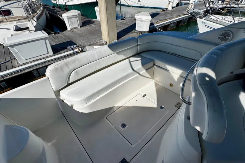 Slide: The Image of 2004 Regal Commodore 3860 yacht interior with white seating at marina. - 19