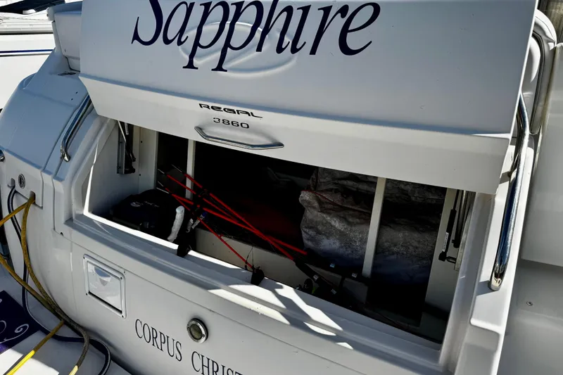 Slide: The Image of 2004 Regal Commodore 3860 boat with open storage compartment, docked in Corpus Christi. - 26