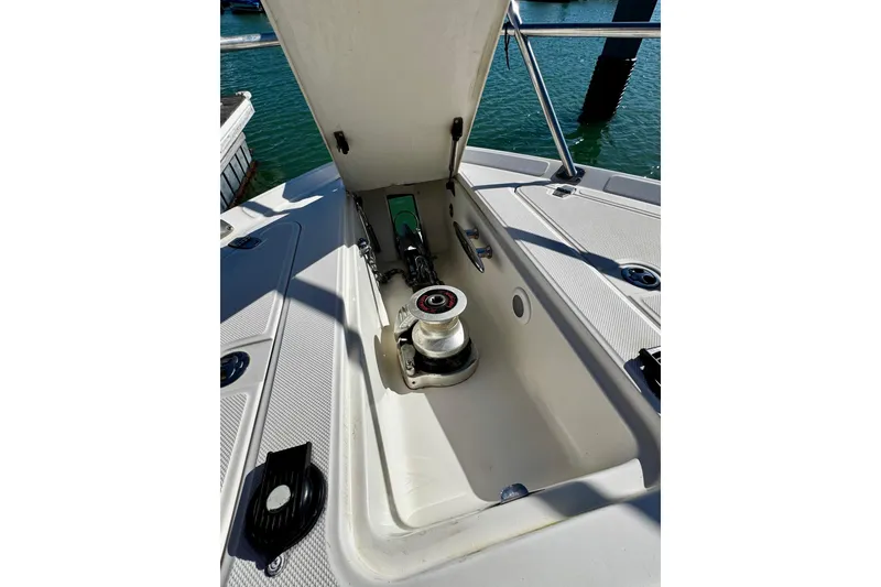 Slide: The Image of Anchor locker of 2004 Regal Commodore 3860 yacht, open with visible winch. - 29