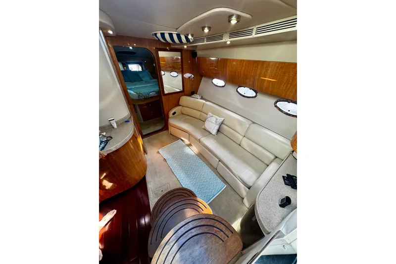 Slide: The Image of Luxurious interior of 2004 Regal Commodore 3860 yacht with leather seating and wood accents. - 34