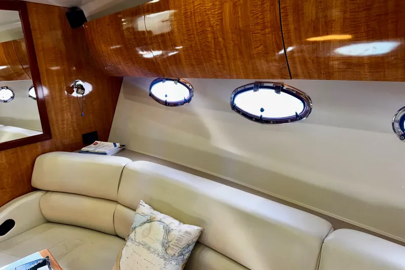 Slide: The Image of Luxurious interior of 2004 Regal Commodore 3860 yacht with leather seating and wood paneling. - 37