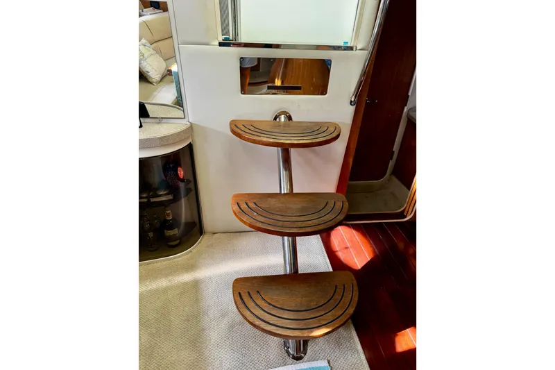 Slide: The Image of Wooden steps inside a 2004 Regal Commodore 3860 yacht, leading to a cabin area. - 41