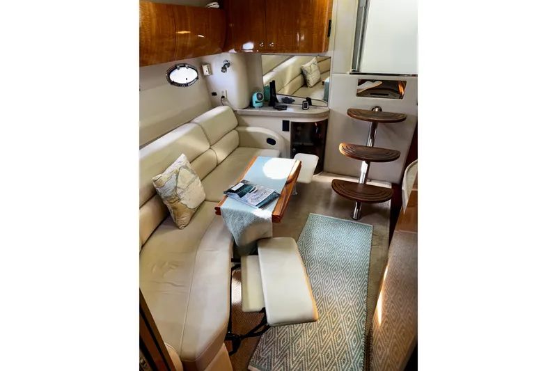 Slide: The Image of Luxurious interior of 2004 Regal Commodore 3860 yacht with plush seating and elegant wood finishes. - 46