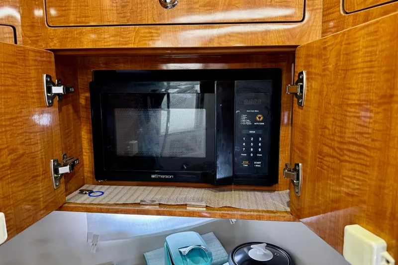 Slide: The Image of Built-in microwave in 2004 Regal Commodore 3860 yacht kitchen cabinet. - 50