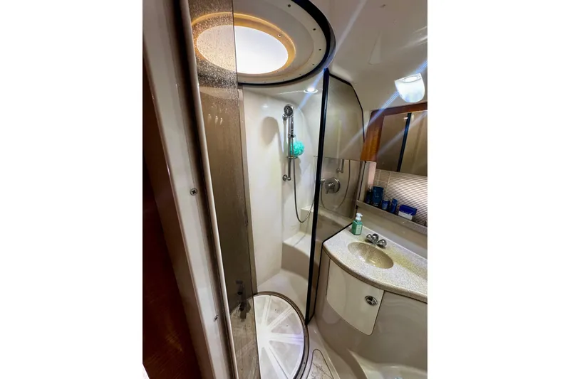 Slide: The Image of Bathroom interior of 2004 Regal Commodore 3860 yacht, featuring shower and sink. - 57