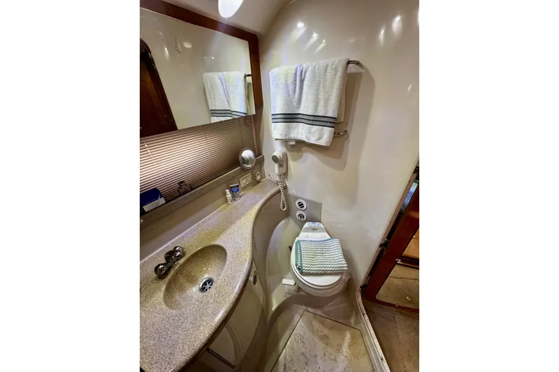 Slide: The Image of Luxurious bathroom in 2004 Regal Commodore 3860 yacht with modern amenities. - 58