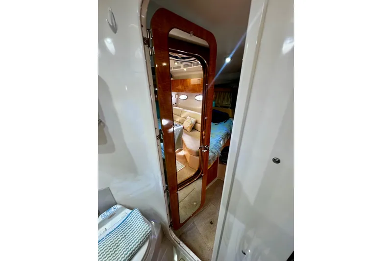 Slide: The Image of Interior view of 2004 Regal Commodore 3860 yacht, featuring a cozy cabin space. - 59
