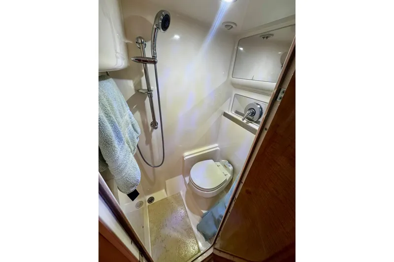 Slide: The Image of Compact bathroom in 2004 Regal Commodore 3860 yacht with shower and toilet. - 67