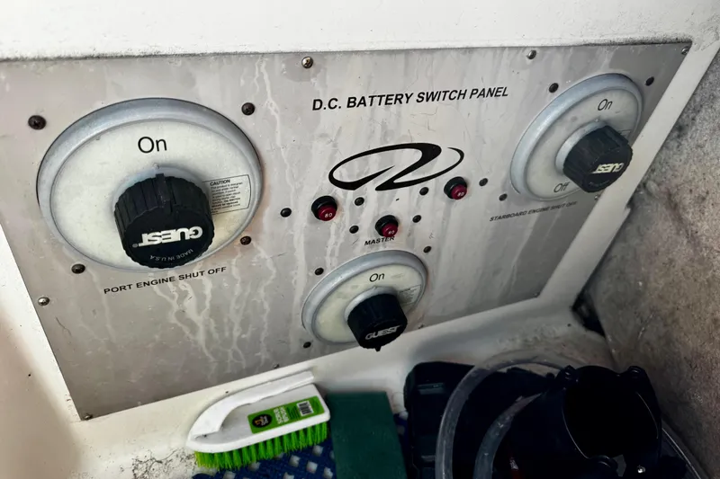 Slide: The Image of 2004 Regal Commodore 3860 DC battery switch panel with controls and indicators. - 68
