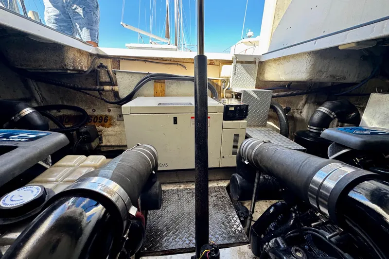 Slide: The Image of Engine room of 2004 Regal Commodore 3860 yacht, featuring mechanical components and equipment. - 70