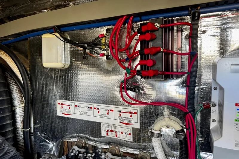 Slide: The Image of Electrical wiring and components inside a 2004 Regal Commodore 3860 boat. - 72