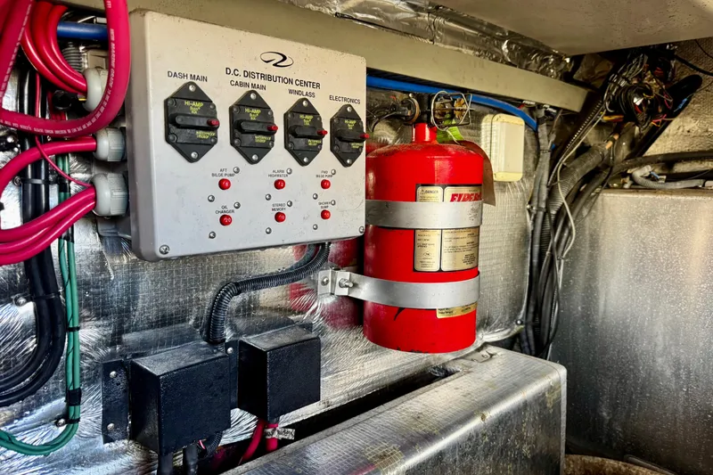 Slide: The Image of Electrical panel and fire extinguisher in 2004 Regal Commodore 3860 boat engine room. - 73