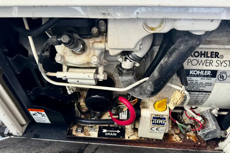 Slide: The Image of 2004 Regal Commodore 3860 engine compartment with Kohler power system components. - 74