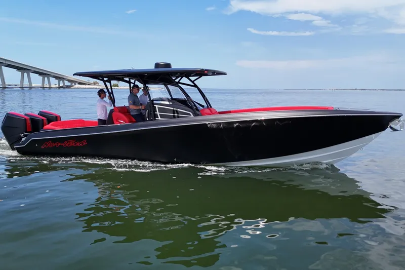 Slide: The Image of 2026 Nor-Tech 340 Sport Center Console boat cruising on open water. - 10