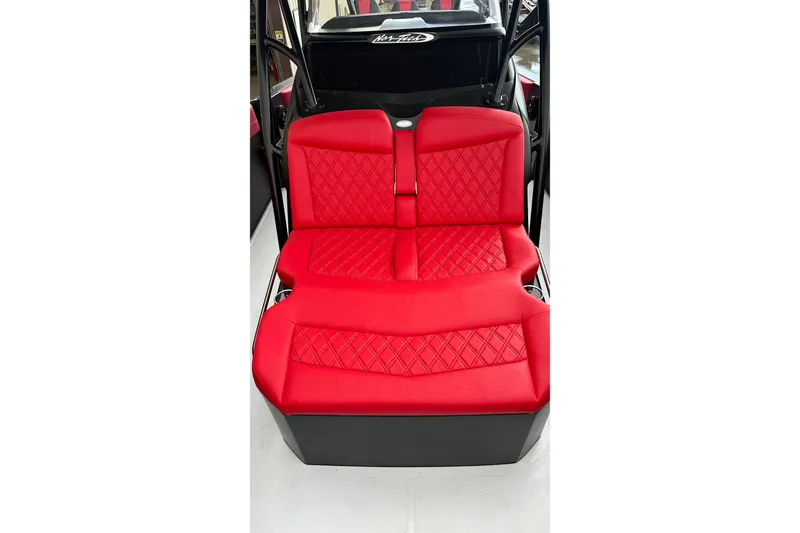 Slide: The Image of Red seating in 2026 Nor-Tech 340 Sport Center Console boat, featuring diamond stitching. - 25