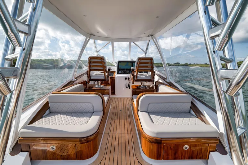 Slide: The Image of Luxurious interior of 2022 Winter Custom Yachts 38 Walk Around, featuring elegant seating and helm. - 16