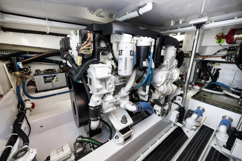 Slide: The Image of Engine room of 2022 Winter Custom Yachts 38 Walk Around, showcasing CAT machinery. - 29