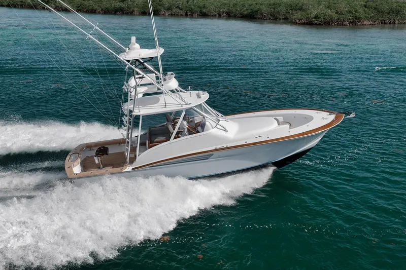 Slide: The Image of 2022 Winter Custom Yachts 38 Walk Around cruising on clear blue water. - 4