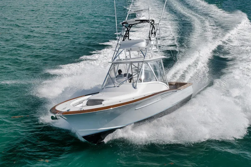 Slide: The Image of 2022 Winter Custom Yachts 38 Walk Around cruising on turquoise water. - 6