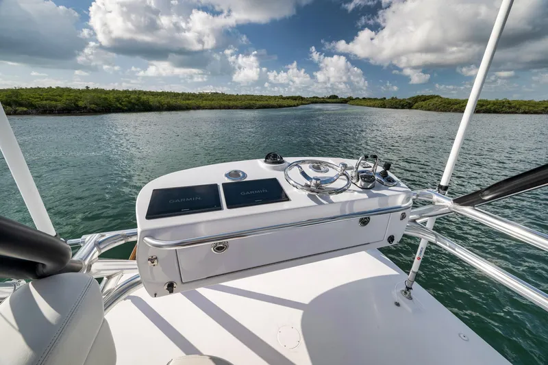 Slide: The Image of Helm of 2022 Winter Custom Yachts 38 Walk Around on serene waterway. - 9