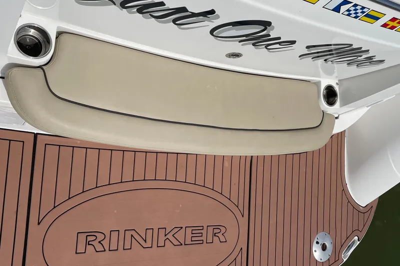 Slide: The Image of 2019 Rinker 370 EX boat deck with custom flooring and seating. - 37