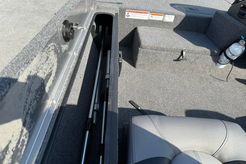 Slide: The Image of Interior of 2023 Crestliner 1700 Storm boat showing rod storage and seating. - 12