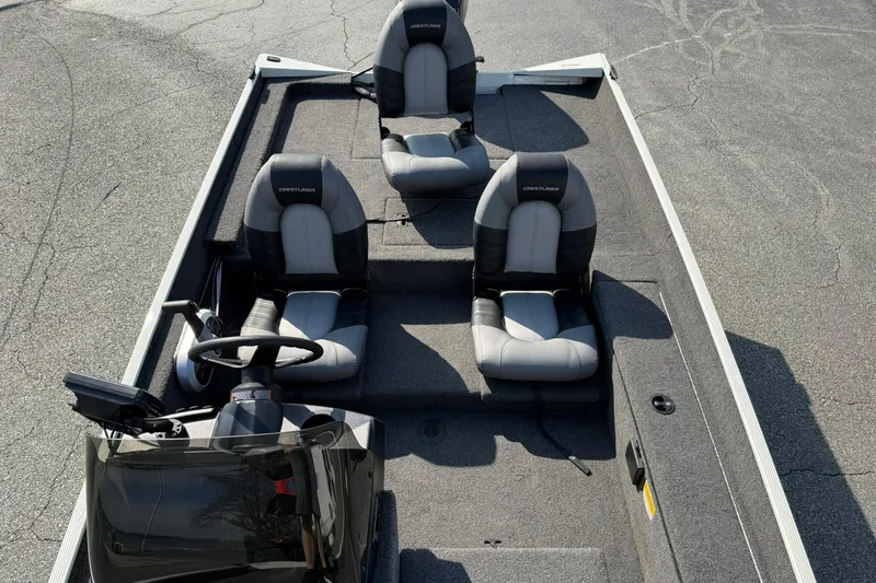 Slide: The Image of 2023 Crestliner 1700 Storm boat interior with three seats and steering console. - 16