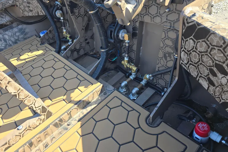 Slide: The Image of Interior view of a 2026 Pro-Drive 2272 boat, showcasing intricate wiring and hexagonal design. - 14