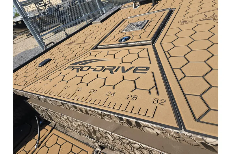 Slide: The Image of Pro-Drive 2272 boat deck with hexagonal pattern and integrated measuring ruler, 2026 model. - 16