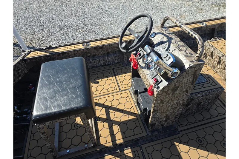 Slide: The Image of Interior of 2026 Pro-Drive 2272 boat with steering console and seating. - 18