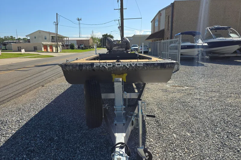 Slide: The Image of Front view of a 2026 Pro-Drive 2272 boat on a trailer in a parking lot. - 3