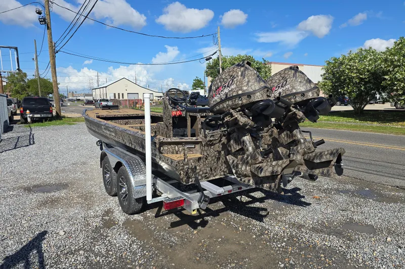 Slide: The Image of Camouflage-patterned Pro-Drive 2272 boat with dual motors on a trailer, 2026 model. - 5