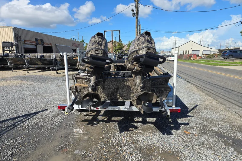 Slide: The Image of Trailer with two camouflaged Pro-Drive 2272 motors, parked on gravel lot, sunny day. - 6
