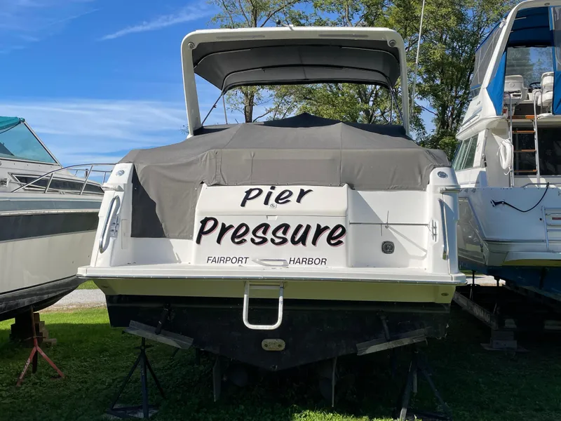Slide: The Image of 1999 Wellcraft 3600 Martinique boat named "Pier Pressure" docked at Fairport Harbor. - 1