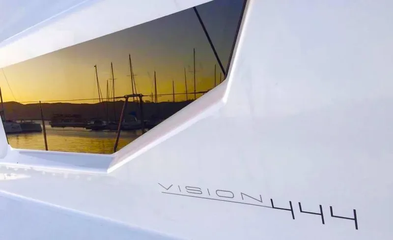 Slide: The Image of Vision 444 yacht reflecting sunset over marina, 2025 model. - 17