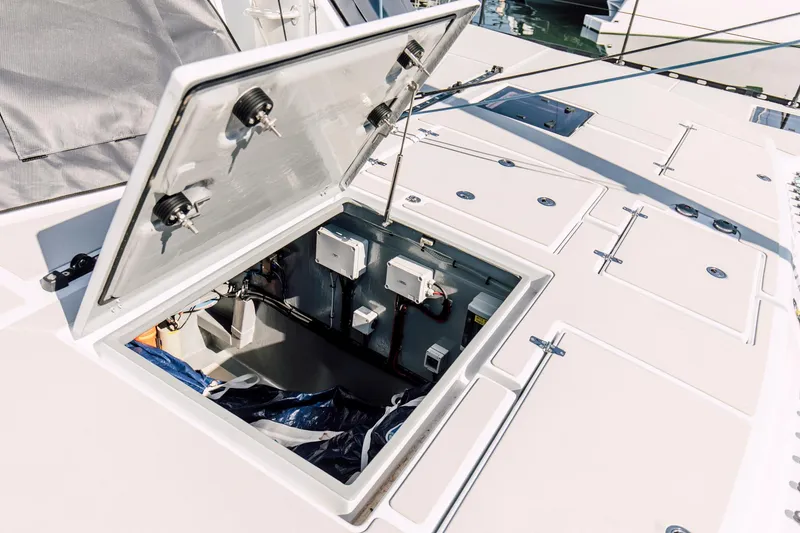 Slide: The Image of Open hatch on Vision 444 yacht, revealing interior storage and electrical components. - 21