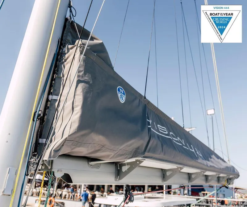 Slide: The Image of Vision 444 sailboat, 2025 model, awarded Boat of the Year 2024, docked at marina. - 27