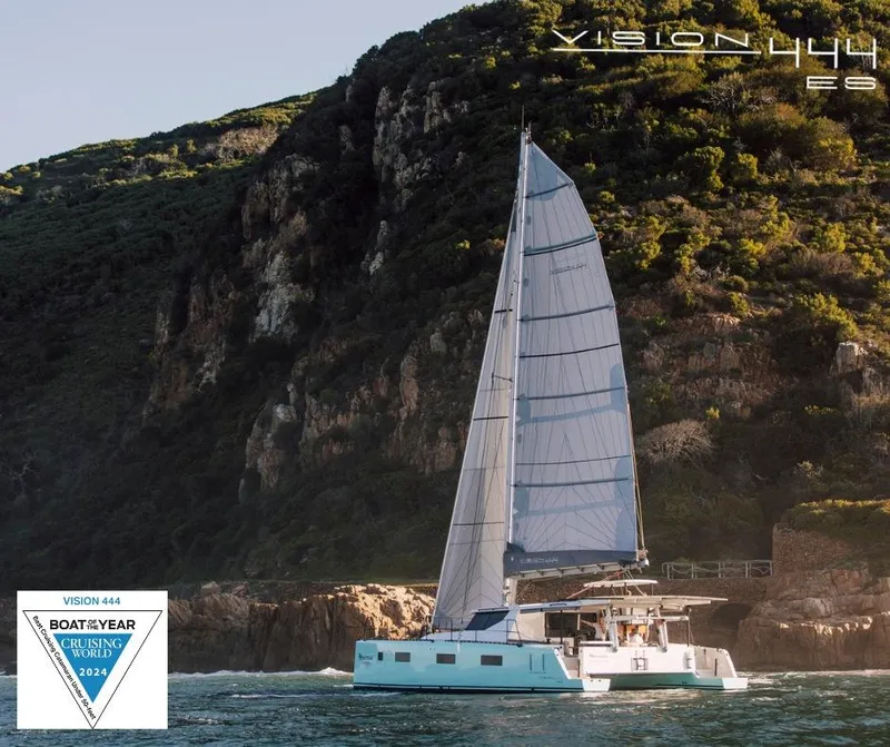 Slide: The Image of Vision 444 ES sailboat cruising near rocky coastline, awarded Boat of the Year 2024. - 3
