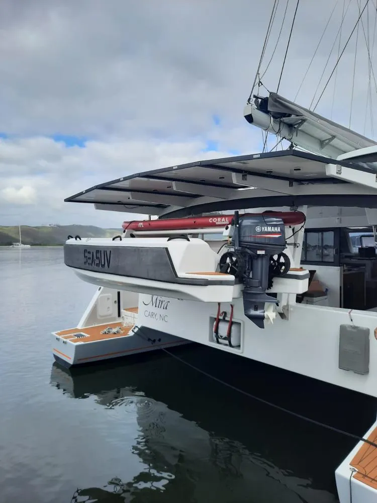 Slide: The Image of Modern Vision 444 yacht with Yamaha motor, docked in calm waters, 2025 model. - 36