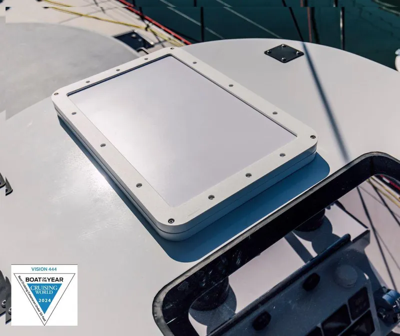 Slide: The Image of Alt text: Vision 444 sailboat deck with hatch, 2025 model, Boat of the Year award. - 37
