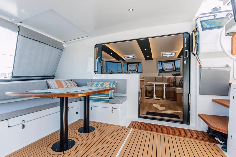 Slide: The Image of Modern Vision 444 yacht interior, 2025 model, featuring sleek seating and wooden flooring. - 41