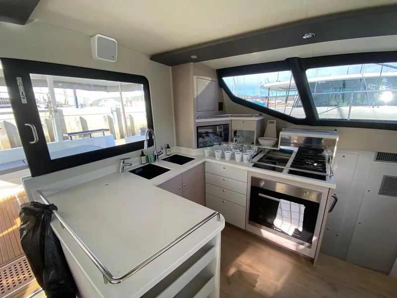 Slide: The Image of Modern kitchen interior on Vision 444 yacht, 2025 model, featuring sleek appliances and ample counter space. - 48