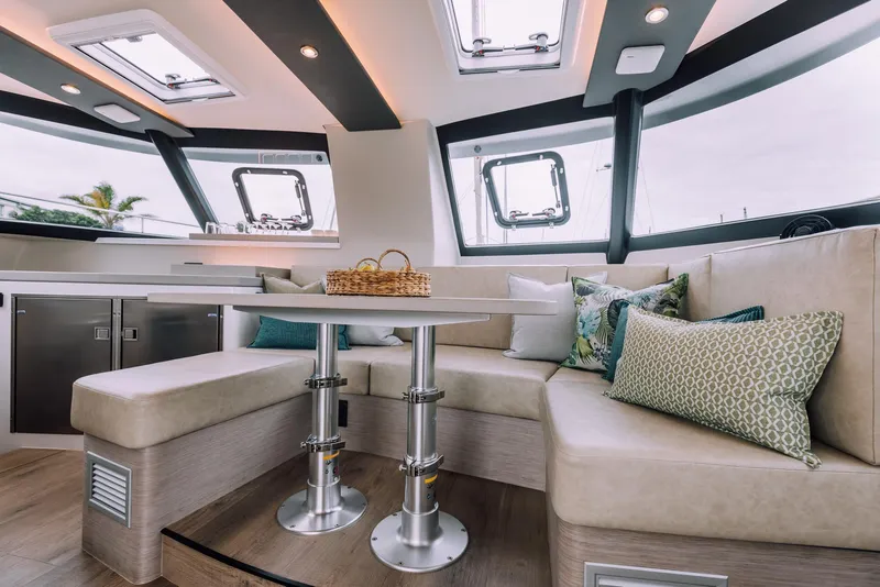 Slide: The Image of Luxurious interior of Vision 444 yacht, 2025 model, featuring a cozy seating area with modern decor. - 51