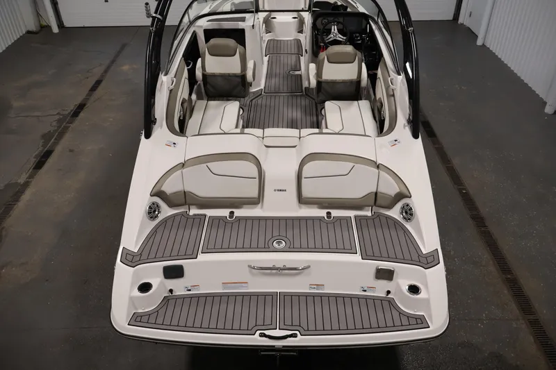 Slide: The Image of 2017 Yamaha Boats 212 Limited S interior view, showcasing seating and deck layout. - 10