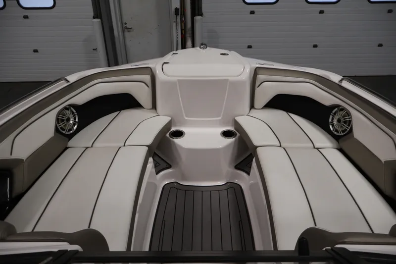 Slide: The Image of 2017 Yamaha Boats 212 Limited S interior with white seating and cup holders. - 11