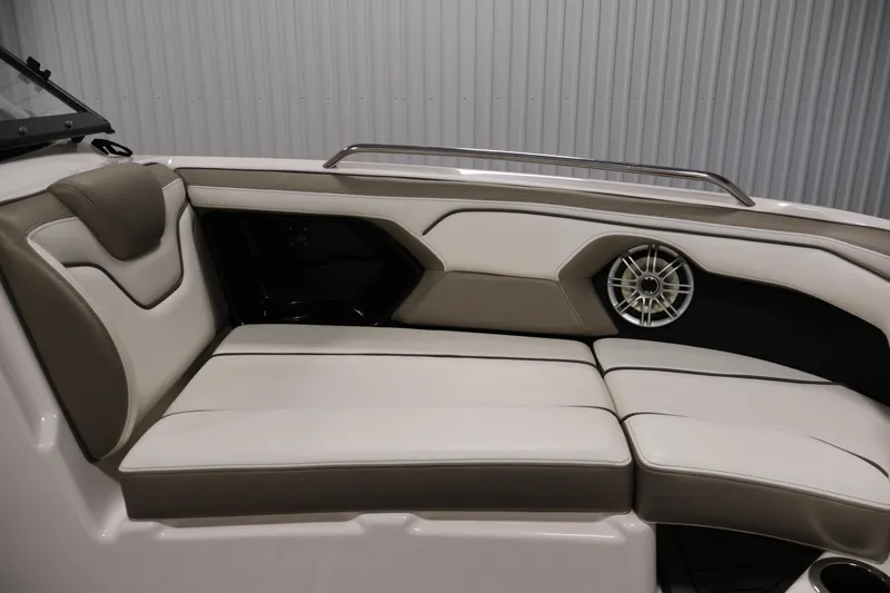 Slide: The Image of 2017 Yamaha Boats 212 Limited S interior with beige seating and speaker detail. - 14