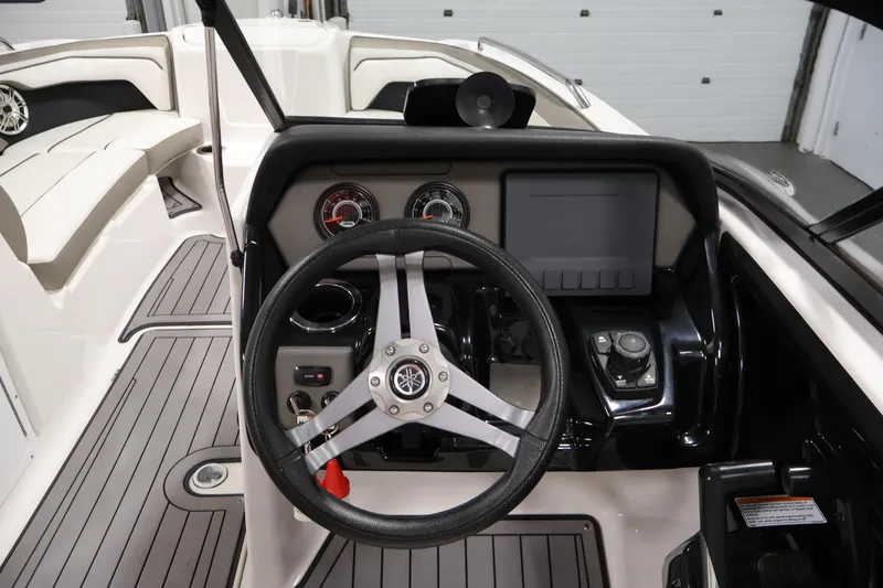 Slide: The Image of 2017 Yamaha Boats 212 Limited S dashboard with steering wheel and controls. - 20