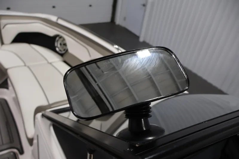 Slide: The Image of 2017 Yamaha Boats 212 Limited S interior with rearview mirror and seating. - 22