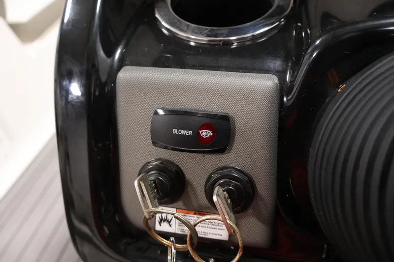 Slide: The Image of Control panel of 2017 Yamaha Boats 212 Limited S with blower switch and keys. - 25