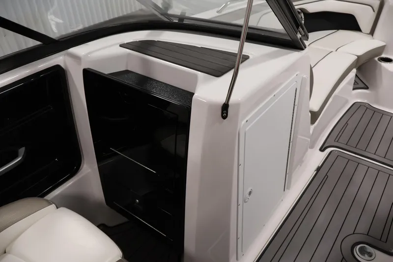 Slide: The Image of 2017 Yamaha Boats 212 Limited S interior with seating and storage compartments. - 30